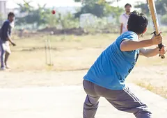 A batsman about to strike the ball