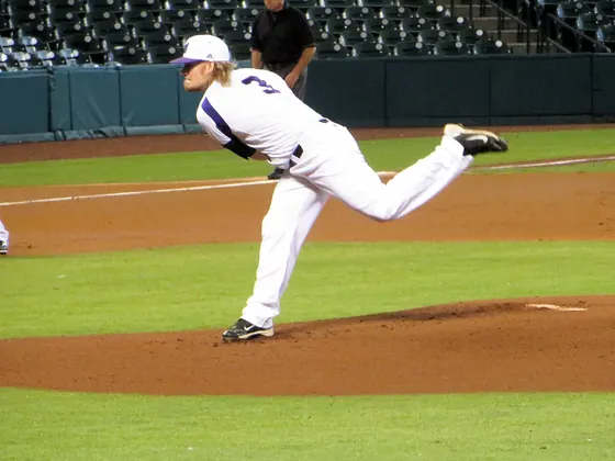 Baseball pitcher in delivery
