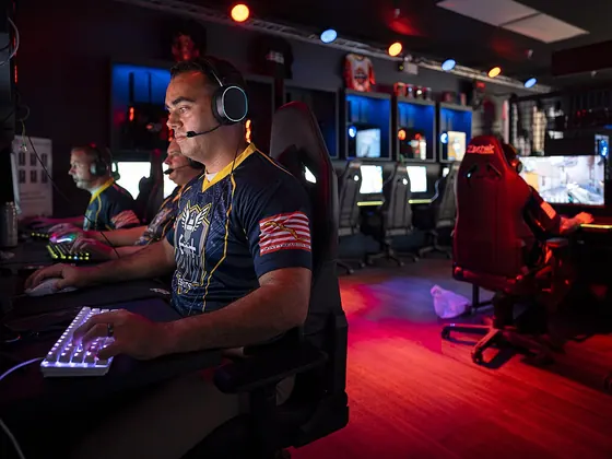 Esports players at their screens